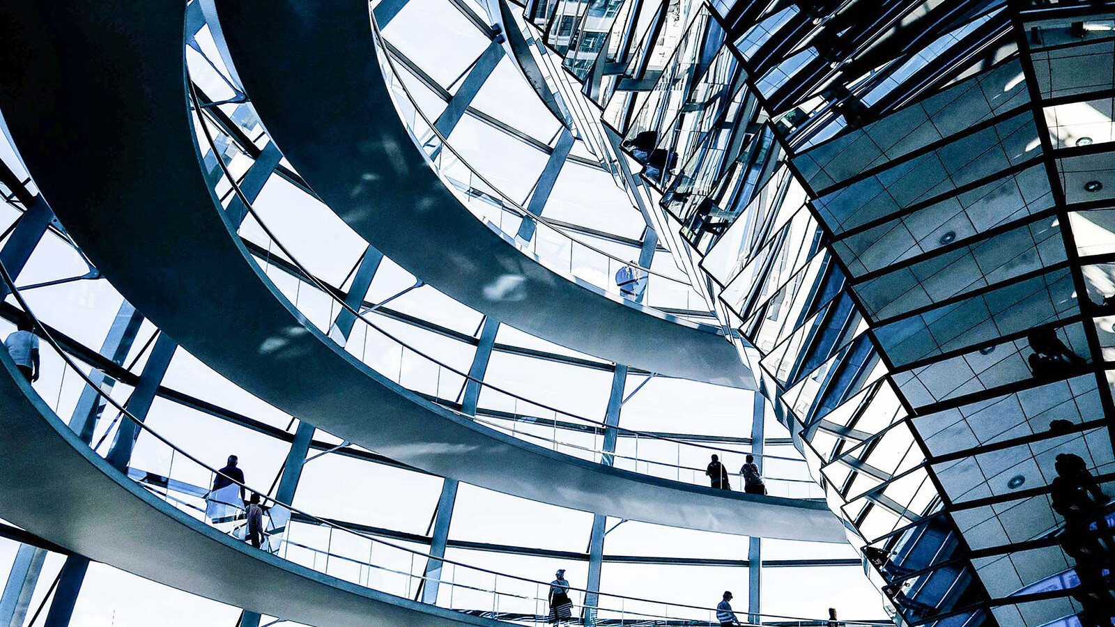 A rounded architecture with plenty of mirrors photographed from the inside. 