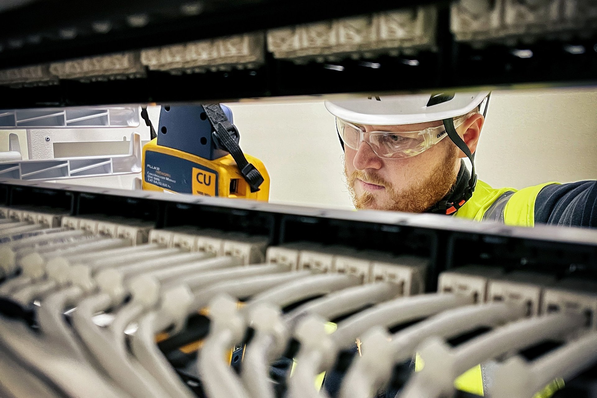 One person in work gear performing inspection onsite.